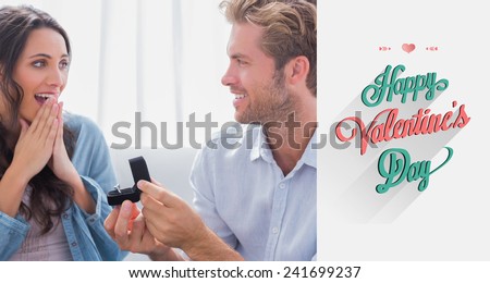 Man asking his partner to marry him against valentines day greeting
