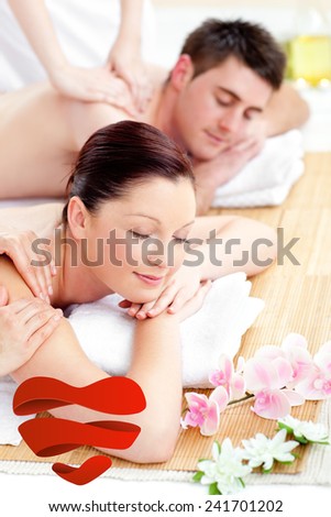 Young couple receiving a back massage against heart