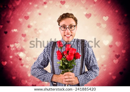 Geeky hipster holding a bunch of roses against valentines heart design