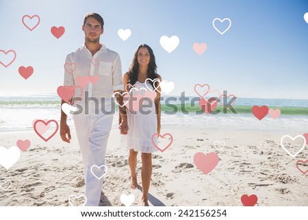 Beautiful couple holding hands and walking towards camera against valentines heart design