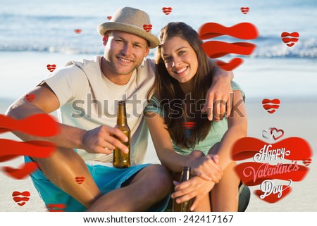Smiling couple embracing while having a drink together against cute valentines message