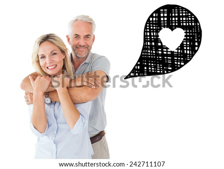 Happy couple standing and hugging against heart in speech bubble