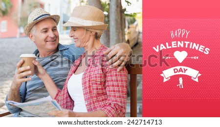 Happy tourist couple drinking coffee on a bench in the city against happy valentines day