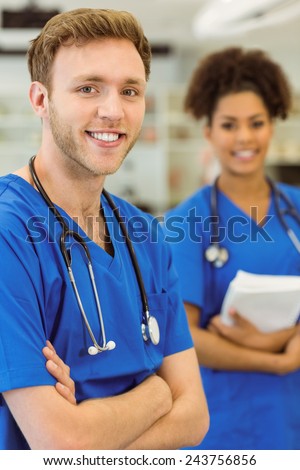 Young medical students smiling at the camera at the university