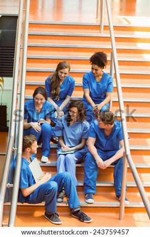 Medical students chatting on the steps at the university