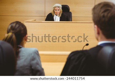 Judge talking with lawyers to make a decision in the court room