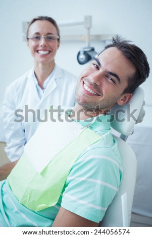 Portrait of smiling young man waiting for a dental exam