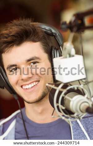 Portrait of an university student recording audio in a studio of a radio