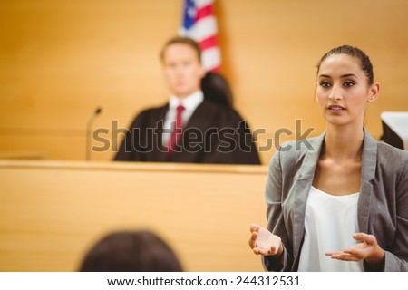 Serious lawyer make a closing statement in the court room