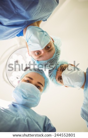 Young surgeons looking down at camera at the university