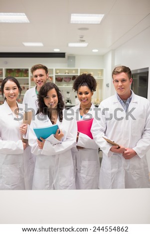 Medical students smiling at camera at the university