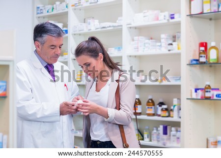 Pharmacist and customer talking about medication in the pharmacy
