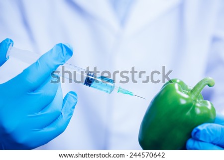 Food scientist injecting a pepper at the university