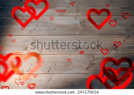 Love heart pattern against bleached wooden planks background