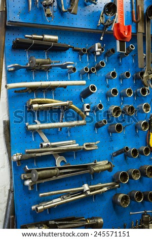 Blue storage wall for tools at the repair garage
