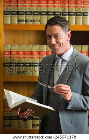 Lawyer reading book in the law library at the university