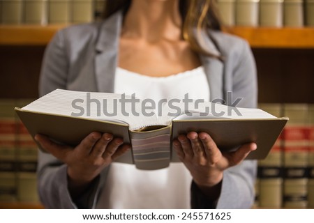 Lawyer reading in the law library at the university