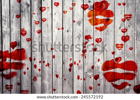Love heart pattern against digitally generated grey wooden planks
