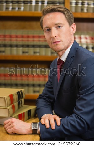 Handsome lawyer in the law library at the university