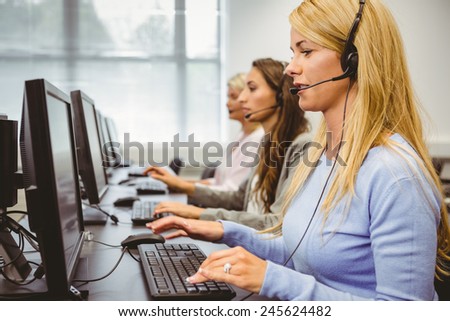 Call centre agents talking on the headset in the office