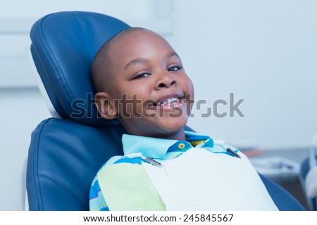 Portrait of smiling boy waiting for a dental exam
