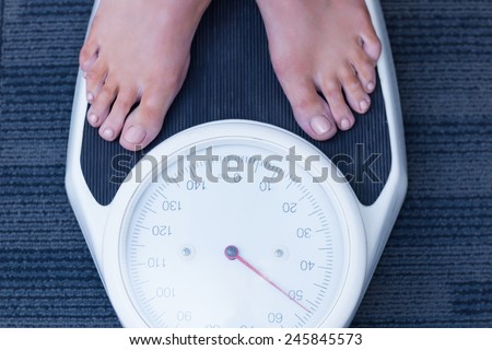 Close up of a woman standing on the scales in hospital