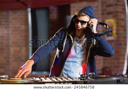 Cool dj spinning the decks at the nightclub