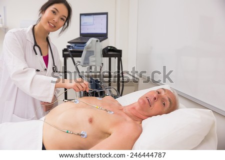 Medical student practicing on older man at the university