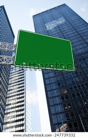 The word a new you and green billboard sign against low angle view of skyscrapers