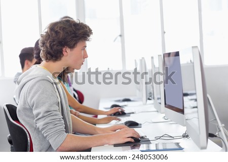 Student working in computer room at the college