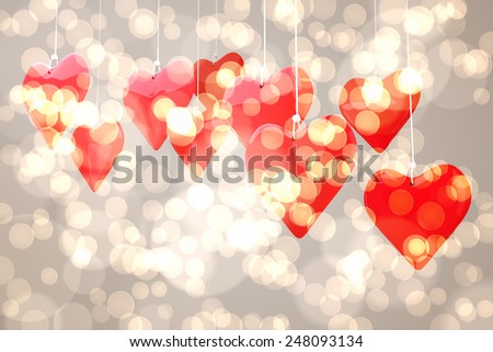 Love hearts against light glowing dots design pattern
