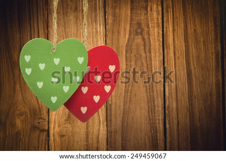 Cute heart decorations against wooden table