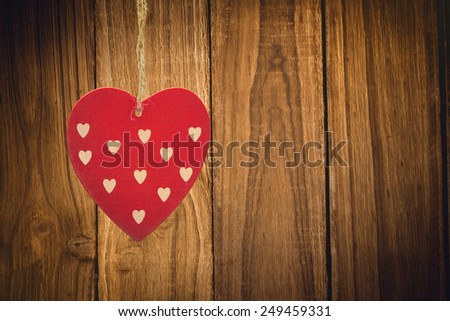 Cute heart decoration against wooden table