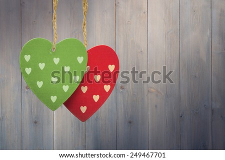 Cute heart decorations against pale grey wooden planks