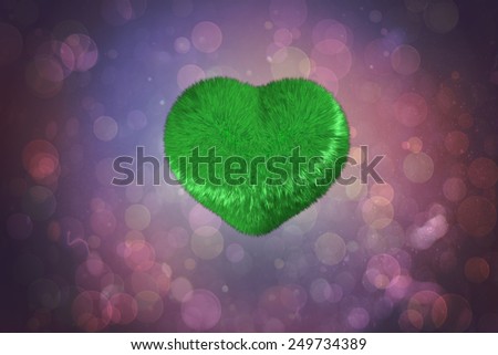 Green heart against purple abstract light spot design