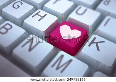 Heart against pink key on keyboard