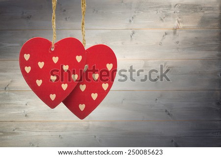 Cute heart decorations against bleached wooden planks background