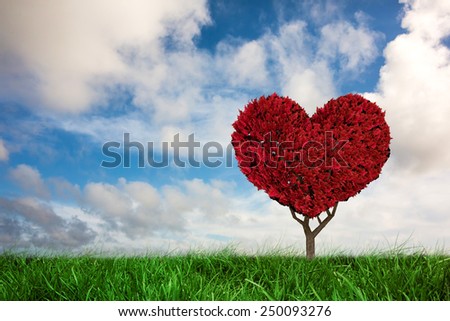 Love heart plant against green grass under blue sky