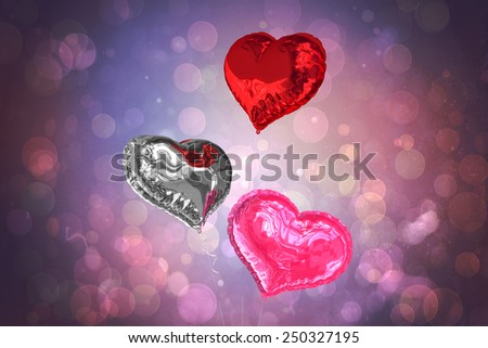 Love heart balloons against purple abstract light spot design
