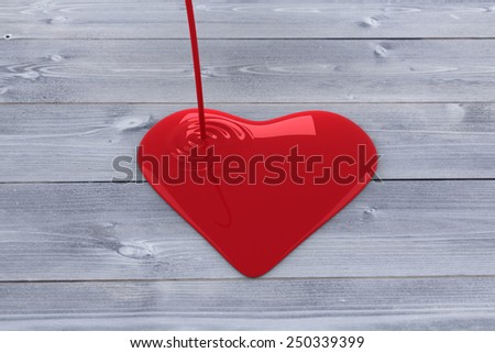 Liquid heart pouring against bleached wooden planks background