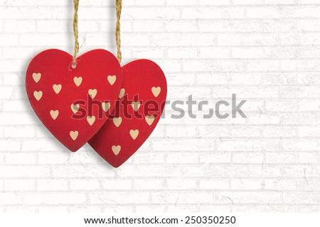 Cute heart decorations against white wall