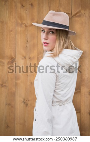 Pretty hipster blonde against bleached wooden planks background
