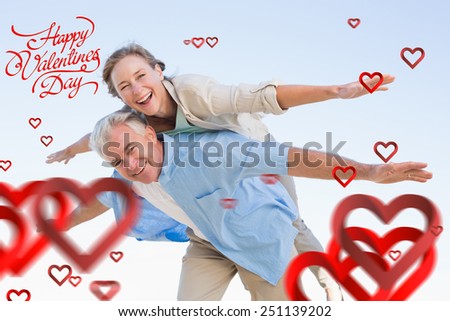 Happy casual couple having fun against happy valentines day