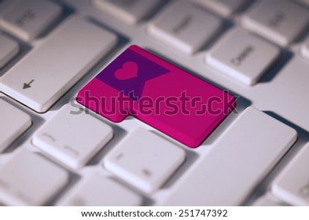 heart label against pink enter key on keyboard