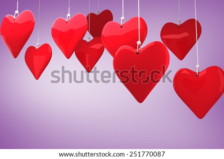 Love hearts against purple vignette