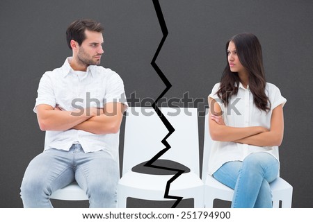 Angry couple not talking after argument against grey