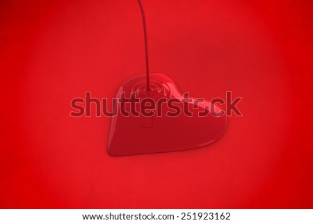 Liquid heart pouring against red background