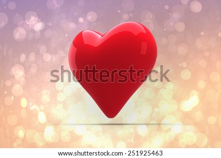 Red heart against pink abstract light spot design