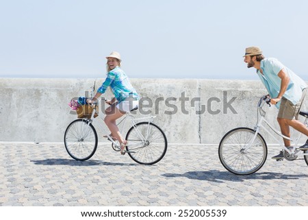 Cute couple on a bike ride on a sunny day