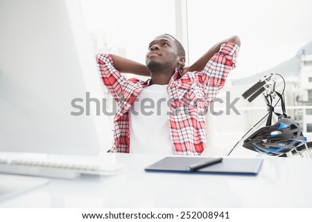 Relaxed casual businessman leaning back in the office